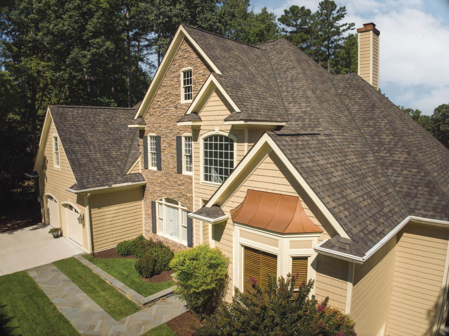 Tan house with a stone accent wall.