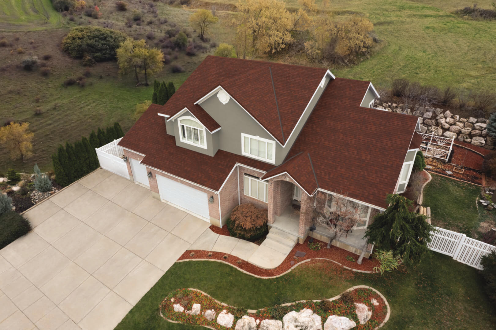 A large house with red roof and white trim.